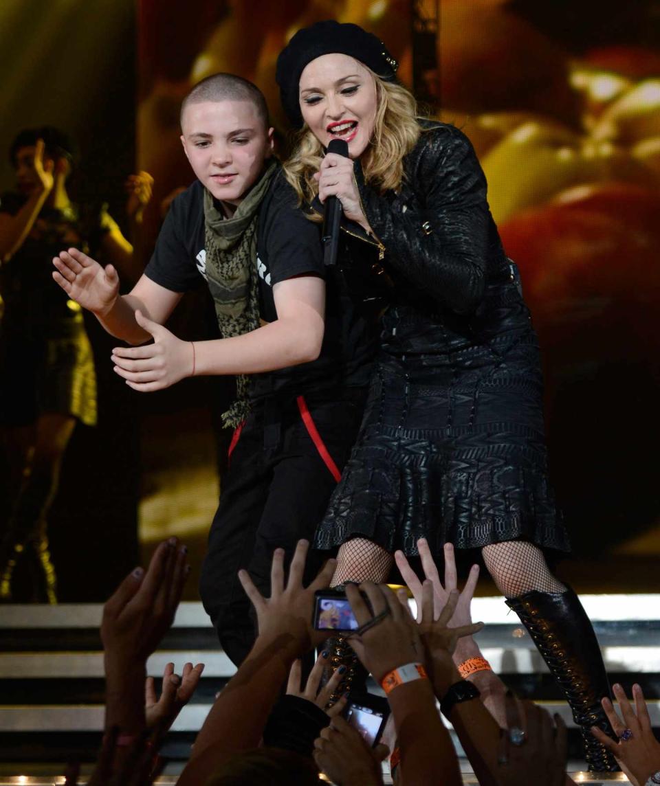 Rocco Ritchie and Madonna perform during the MDNA North America tour opener at the Wells Fargo Center on August 28, 2012 in Philadelphia, Pennsylvania