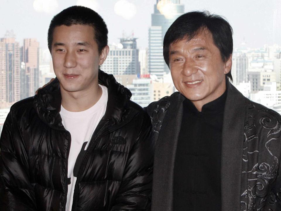 <p>Cao Ji/Visual China Group /Getty</p> Jackie Chan and his son Jaycee Chan attend a press conference announcing a concert at the Bird