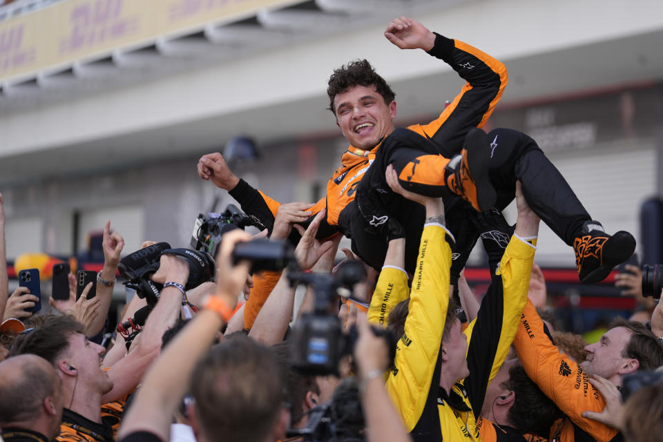 McLaren driver Lando Norris, of Britain, is lifted after winning the Miami Formula One Grand Prix auto race Sunday, May 5, 2024, in Miami Gardens, Fla. (AP Photo/Rebecca Blackwell)