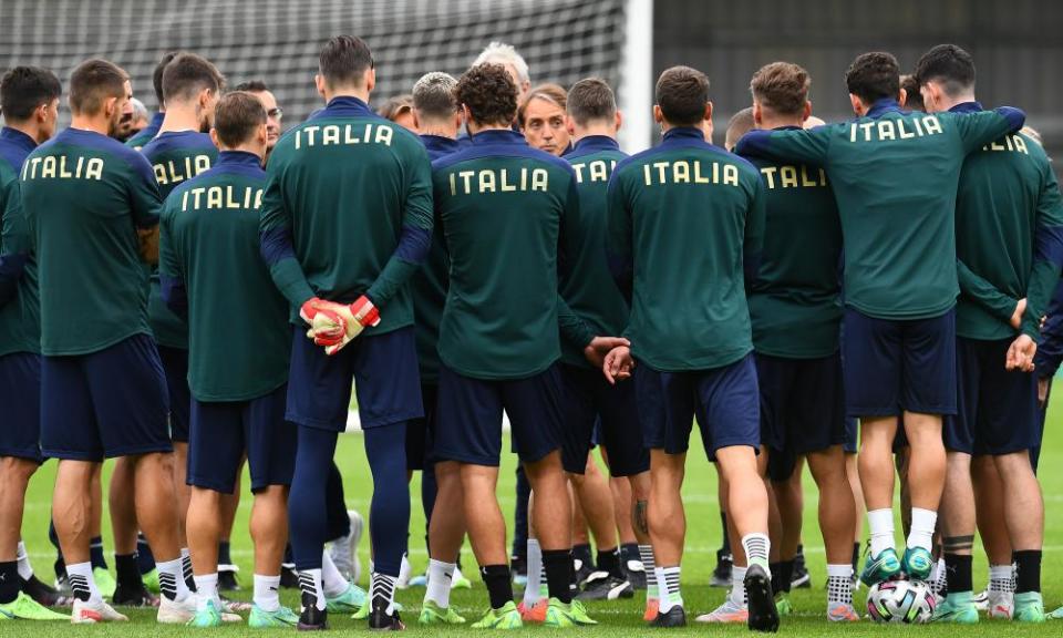 Roberto Mancini (centre) talks to his Italy squad in training at Barnet on Monday.