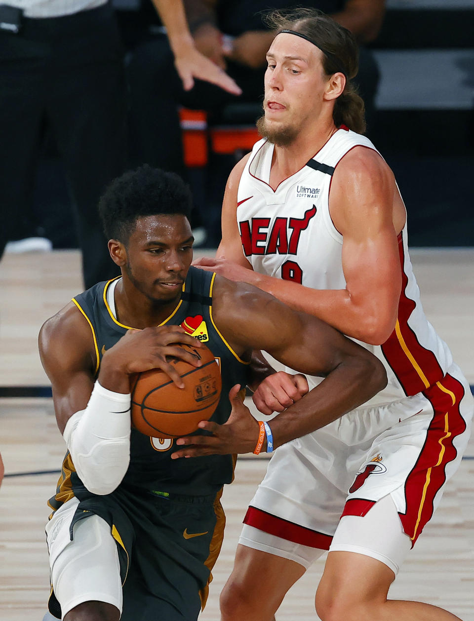 Miami Heat's Kelly Olynyk, right, fouls Oklahoma City Thunder's Hamidou Diallo during the second half of an NBA basketball game Wednesday, Aug. 12, 2020, in Lake Buena Vista, Fla. (Kevin C. Cox/Pool Photo via AP)