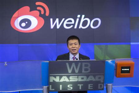 Weibo Corporation Chairman Charles Chao speaks before ringing the opening bell during a visit the NASDAQ MarketSite in Times Square in celebration of Weibo's initial public offering (IPO) on The NASDAQ Stock Market in New York April 17, 2014. REUTERS/Andrew Kelly