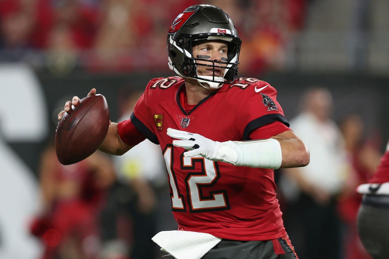Tampa Bay Buccaneers quarterback Tom Brady (12) drops back to pass in the first half of an NFL football game against the New Orleans Saints in Tampa, Fla