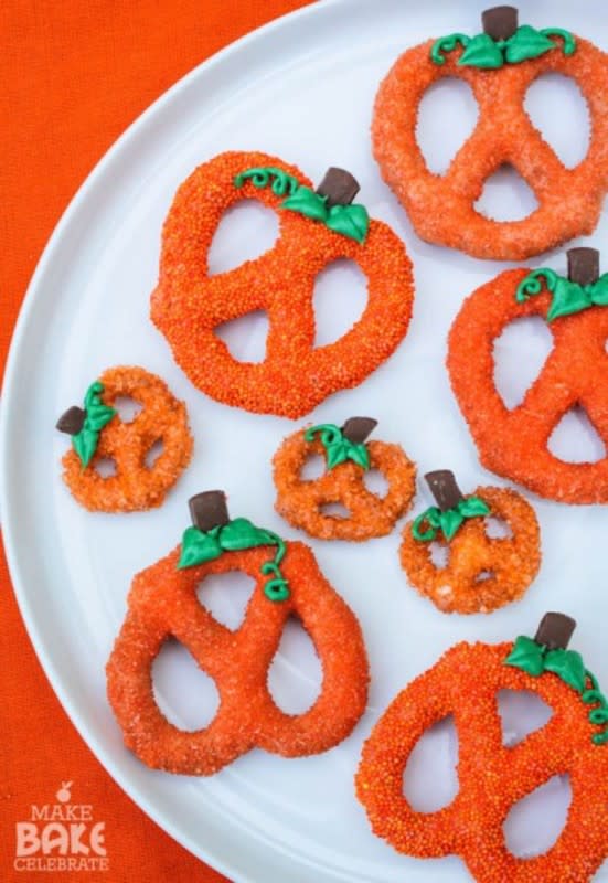 <p>Make Bake Celebrate</p><p>If you’re looking for a way to incorporate pumpkins without making a whole pie, check out <a href="http://makebakecelebrate.com/chocolate-covered-pumpkin-pretzels/" rel="nofollow noopener" target="_blank" data-ylk="slk:Make Bake Celebrate;elm:context_link;itc:0;sec:content-canvas" class="link rapid-noclick-resp">Make Bake Celebrate</a> for a quick and easy snack inspired by the orange and green gourd! </p>