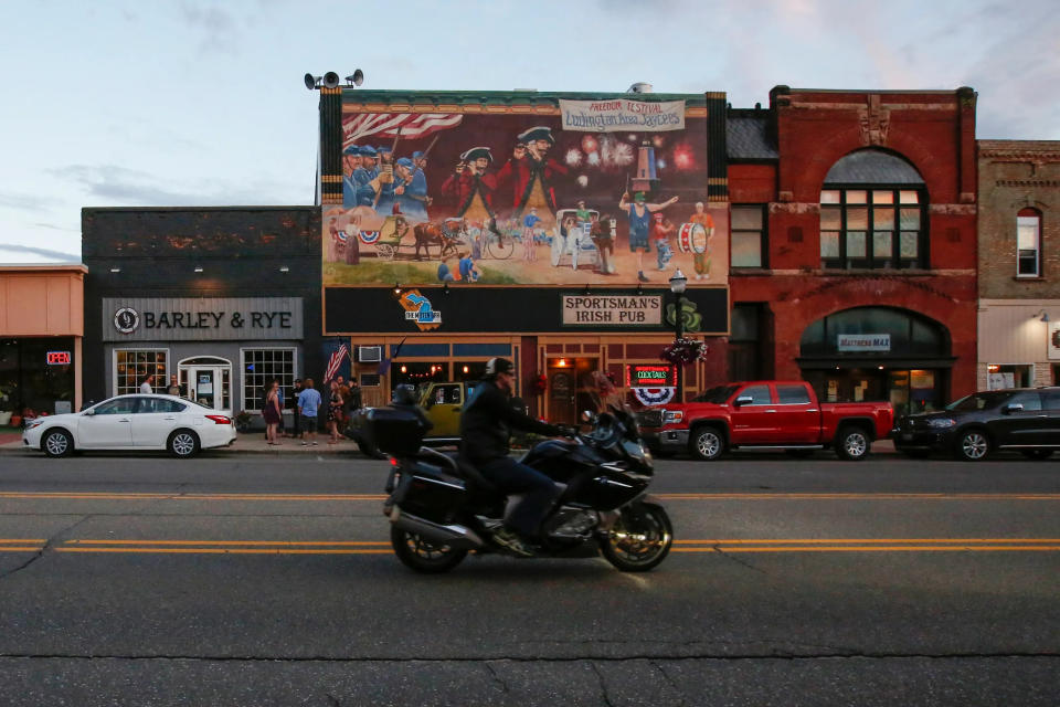 A motorcyclist drives down the main strip of downtown Ludington, Michigan, June 23, 2017.