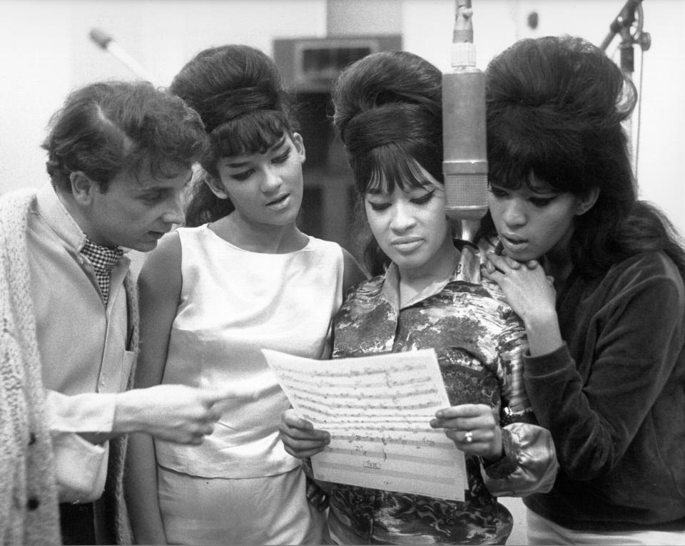 Phil Spector looked at sheet music with hit trio The Ronettes at Gold Star Studios in 1963. (Photo: Ray Avery via Getty Images)