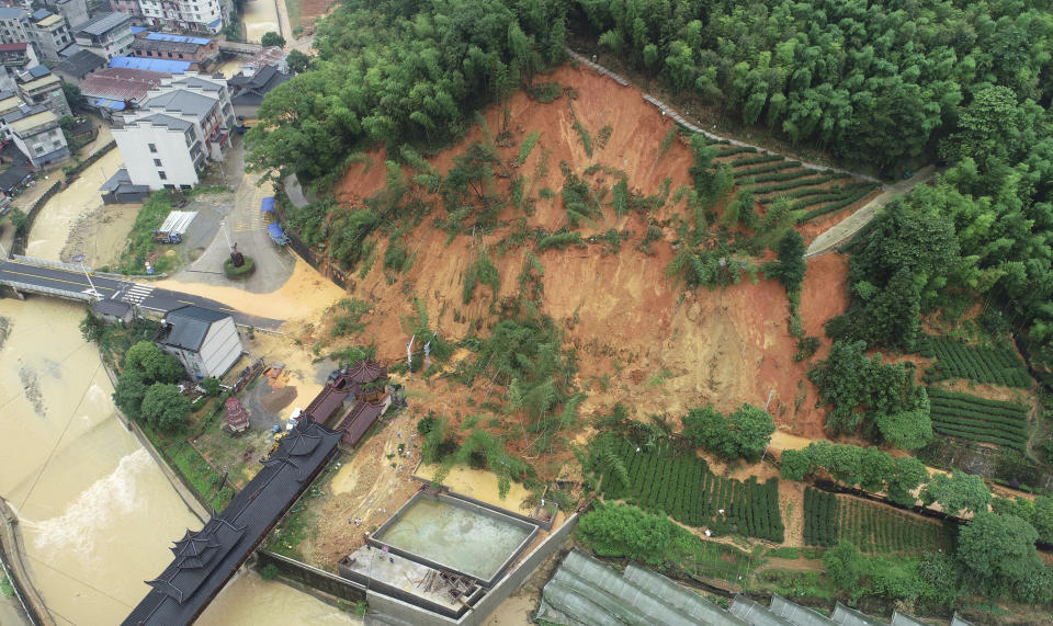 This aerial drone photo released by Xinhua News Agency, shows an area affected by torrential rains in Tieshan Township of Zhenghe County, Nanping City, southeast China's Fujian Province, on June 16, 2024. A family of six was found dead by rescuers in Fujian province, state media reported Saturday, June 22, adding to the extreme weather deaths after downpours caused landslides in the area, even as authorities extended a warning of more severe weather ahead. (Huang Jiemin/Xinhua via AP)