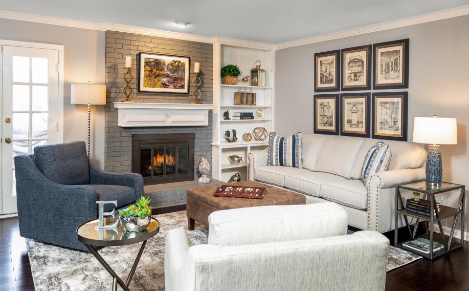 The look of this living room was inspired by the framed architectural artwork in this redesigned living room in Louisville.