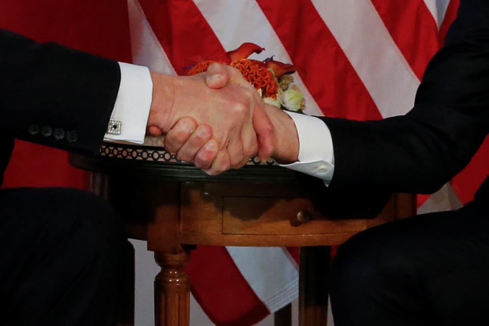 <p>President Donald Trump (L) and France’s President Emmanuel Macron shake hands before a working lunch ahead of a NATO Summit in Brussels, Belgium, May 25, 2017. (Photo: Jonathan Ernst/Reuters) </p>