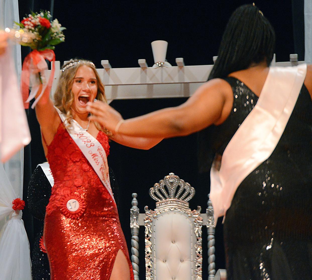 Stella Blake celebrates as she runs to 2022 Carnation Festival Queen Kayla Martin after being announced as the 2023 queen on Saturday, July 29, 2023, at the 2023 Greater Alliance Carnation Festival pageant at Alliance High School.