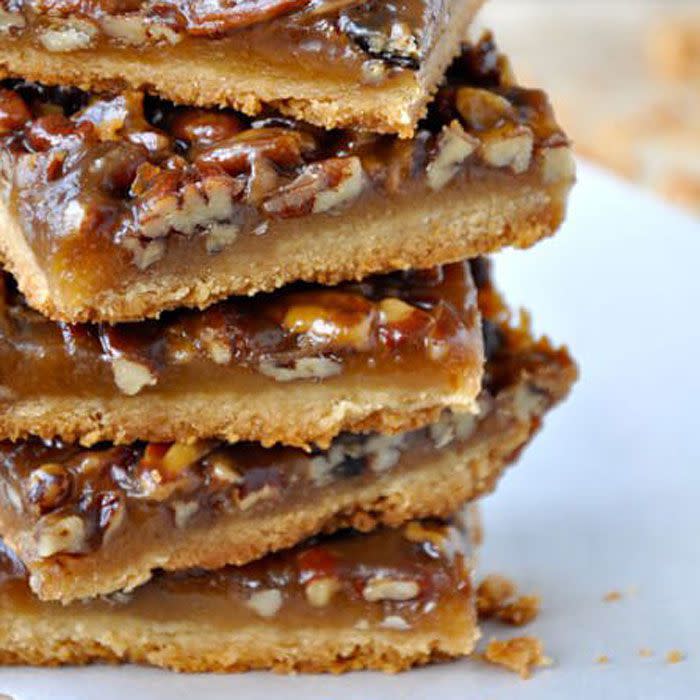 <p>Making pecan pie in bar form cuts out nearly all the work of actually, you know, baking a pie. And dessert just tastes better when you don't have to work so hard for it. </p><p><strong>Get the recipe at <a rel="nofollow noopener" href="http://www.justataste.com/pecan-pie-bars-recipe/" target="_blank" data-ylk="slk:Just a Taste;elm:context_link;itc:0;sec:content-canvas" class="link ">Just a Taste</a>.</strong></p>