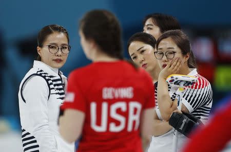 Curling - Pyeongchang 2018 Winter Olympics - Women's Round Robin - U.S. v South Korea - Gangneung Curling Center - Gangneung, South Korea - February 20, 2018 - Kim Eun-jung, Kim Kyeong-ae and Kim Seon-yeong of South Korea. REUTERS/Cathal McNaughton