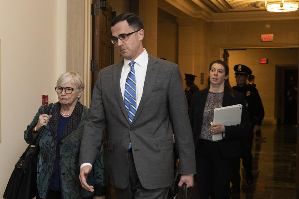 Tim Morrison, a former official at the National Security Council, arrives to testify before the House Intelligence Committee on Capitol Hill in Washington, Tuesday, Nov. 19, 2019, during a public impeachment hearing of President Donald Trump's efforts to tie U.S. aid for Ukraine to investigations of his political opponents. (AP Photo/Manuel Balce Ceneta)