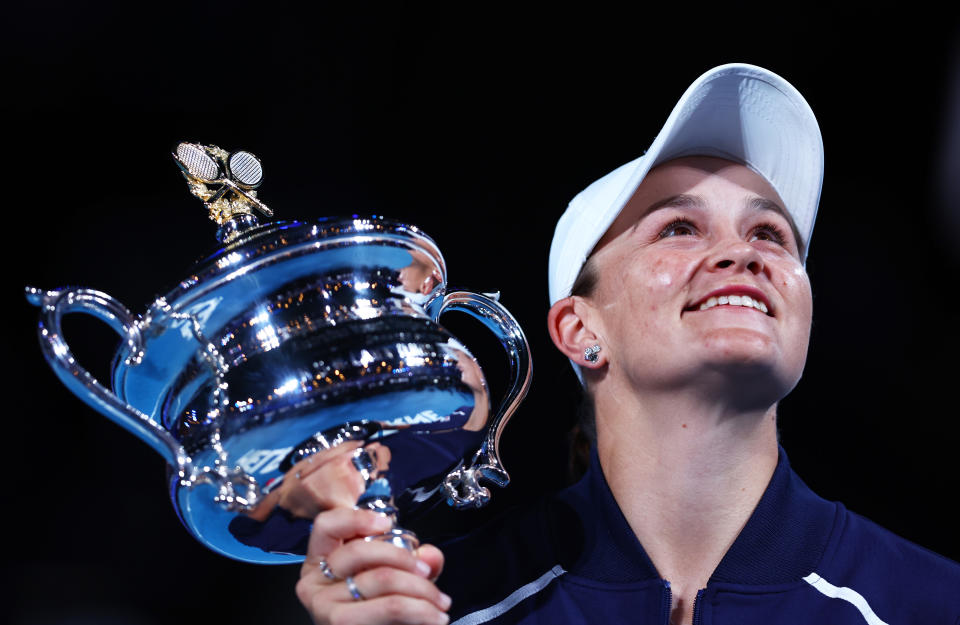 Ash Barty (pictured) poses with the Australian Open trophy.