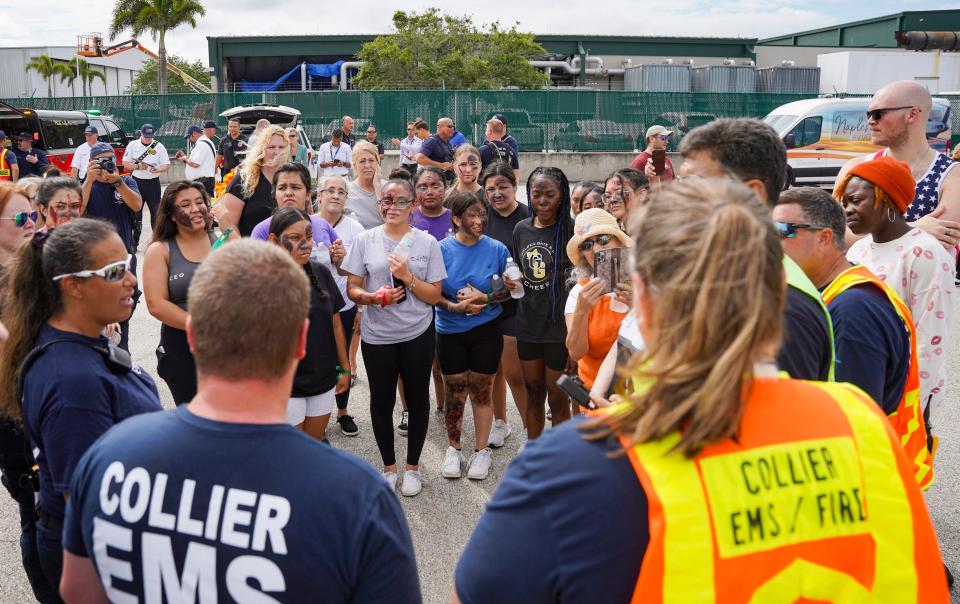 First responders and students from Lorenzo Walker Technical College gather for a debriefing after a simulated disaster exercise at Naples Airport on Tuesday, April 25, 2023.