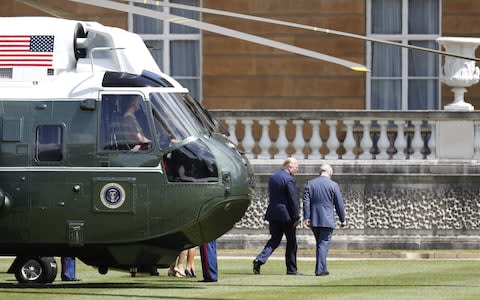Donald Trump and Prince Charles walk to Buckingham Palace - Credit: Adrian Dennis/AFP