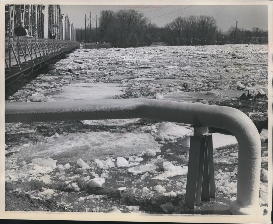 In this historic file photo, floating ice and high water neared the floor of a bridge over the Mississippi River at La Crosse.