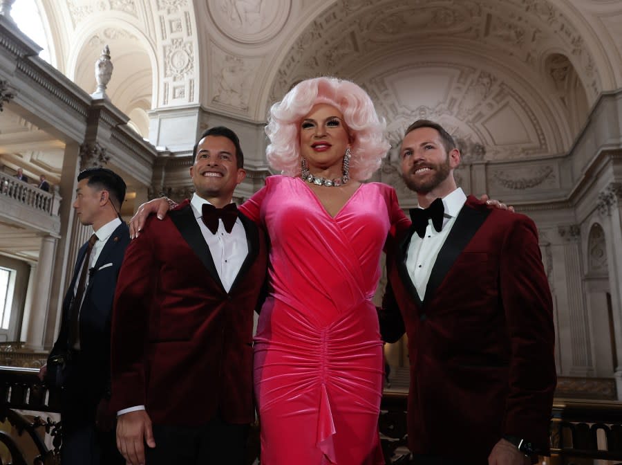 San Francisco Drag Laureate D’Arcy Drollinger poses with same-sex couple Jorge Jimenez (L) and Scott Wilson during a “Winter of Love” ceremony at City Hall on February 14, 2024. (Photo by Justin Sullivan/Getty Images)