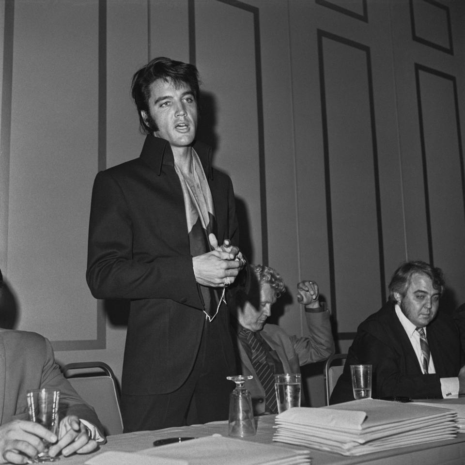 Elvis Presley wearing a jacket with a scarf in the 'convention hall' of the International Hotel in Las Vegas, Nevada, 1st August 1969