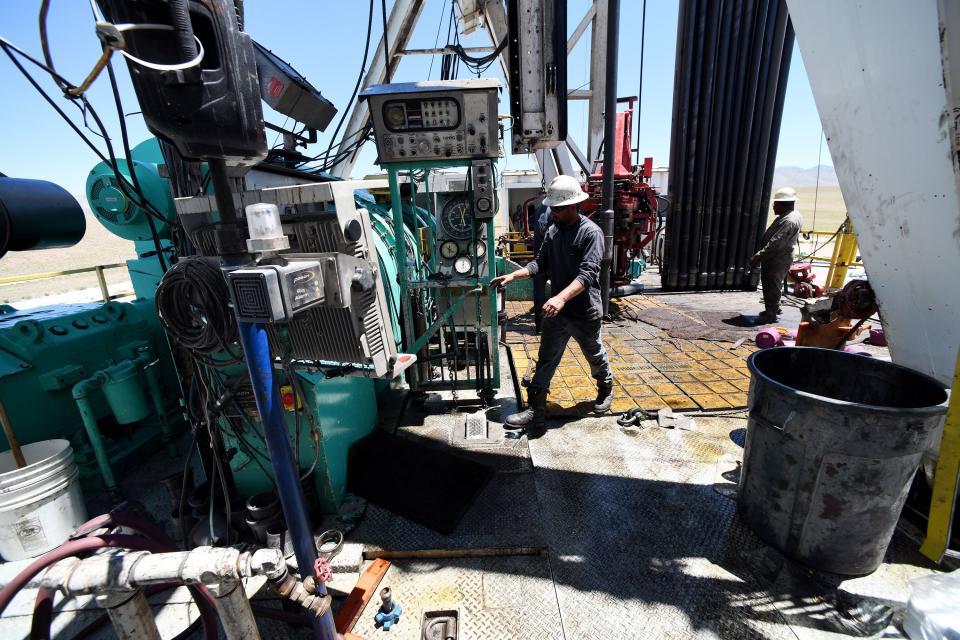 Crew members work on a drilling rig at the FORGE geothermal demonstration sight near Milford on Thursday, July 6, 2023. Media were given a tour of the facility. | Scott G Winterton, Deseret News