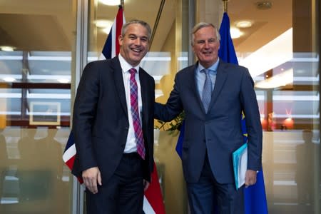 Britain's Brexit Secretary Barclay poses with EU's chief Brexit negotiator Barnier in Brussels