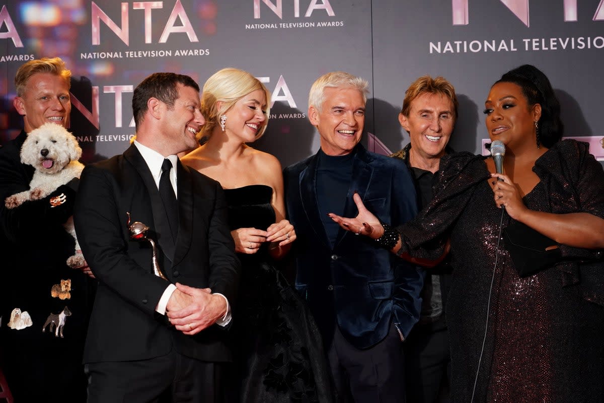 Holly Willoughby and Phillip Schofield celebrate after winning the Daytime award for This Morning at the National Television Awards 2022 (Ian West/PA) (PA Archive)