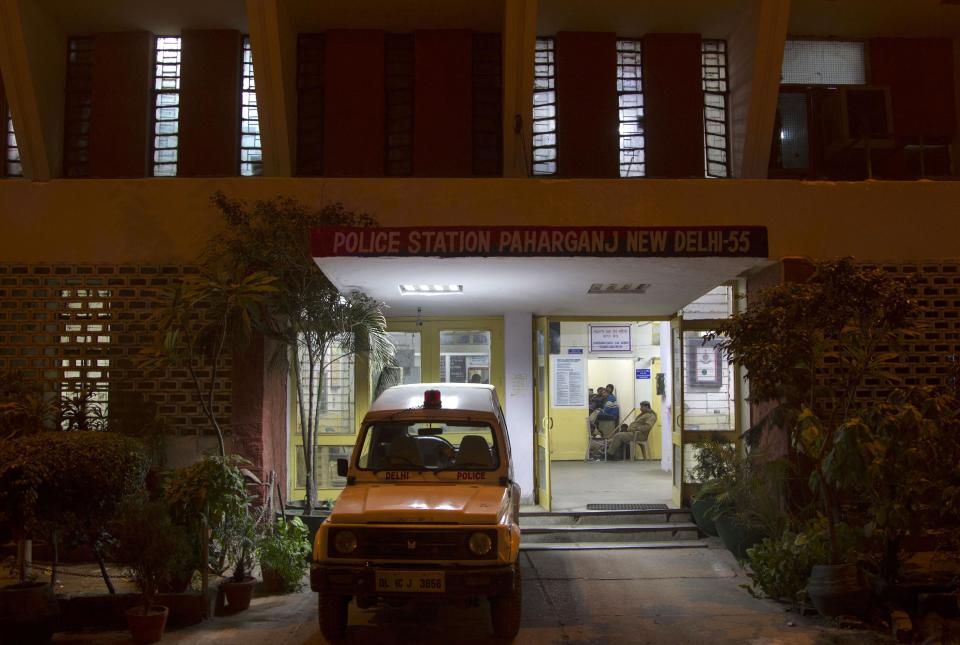 Indian policemen sit inside the police station which is investigating the gang-rape of a Danish tourist in New Delhi, India, Wednesday, Jan. 15, 2014. A 51-year-old Danish tourist was gang-raped near a popular shopping area in New Delhi after she stopped to ask for directions, police said Wednesday, the latest case to focus attention on the scourge of violence against women in India. The woman managed to reach her hotel in Paharganj area Tuesday evening and the owner called police. (AP Photo/Tsering Topgyal)