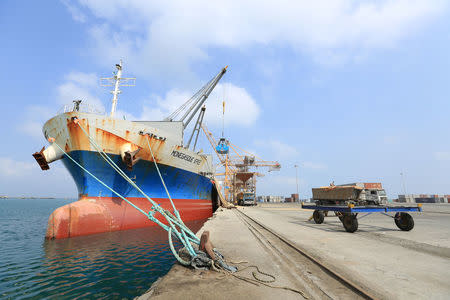 A ship unloads a cargo of wheat at the port of Hodeida, Yemen April 1, 2018. Picture taken April 1, 2018. REUTERS/Abduljabbar Zeyad