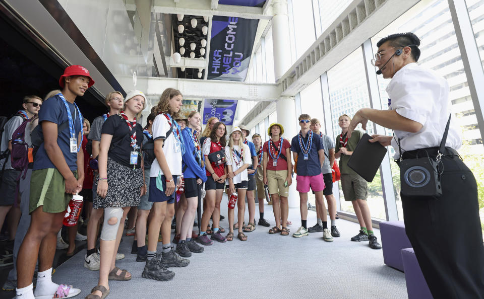 In this photo provided by the South Korean Ministry of Culture, Sports and Tourism, members of Norwegian and Danish scouts tour the Korea Tourism Organization Seoul Center in Seoul, South Korea, Wednesday, Aug. 9, 2023. Khanun has forced South Korea to evacuate the World Scout Jamboree that had been taking place at a coastal campsite in the southwestern county of Buan. (South Korean Ministry of Culture, Sports And Tourism via AP)