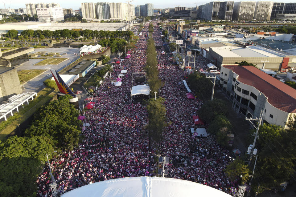 Crowds gather during a campaign rally of presidential candidate, current Vice President Leni Robredo, in Pasay City, Philippines on Sunday, April 24, 2022. Followers from diverse backgrounds, families with their grandparents and children, activists, doctors, Catholic church people, TV and movie stars, farmers, students, have jammed Robredo's fiesta-like campaign rallies in the tens of thousands in recent weeks. She called the emerging movement a "pink revolution" in October because many of her volunteers were clad in that color of advocacy. (AP Photo/Aaron Favila)