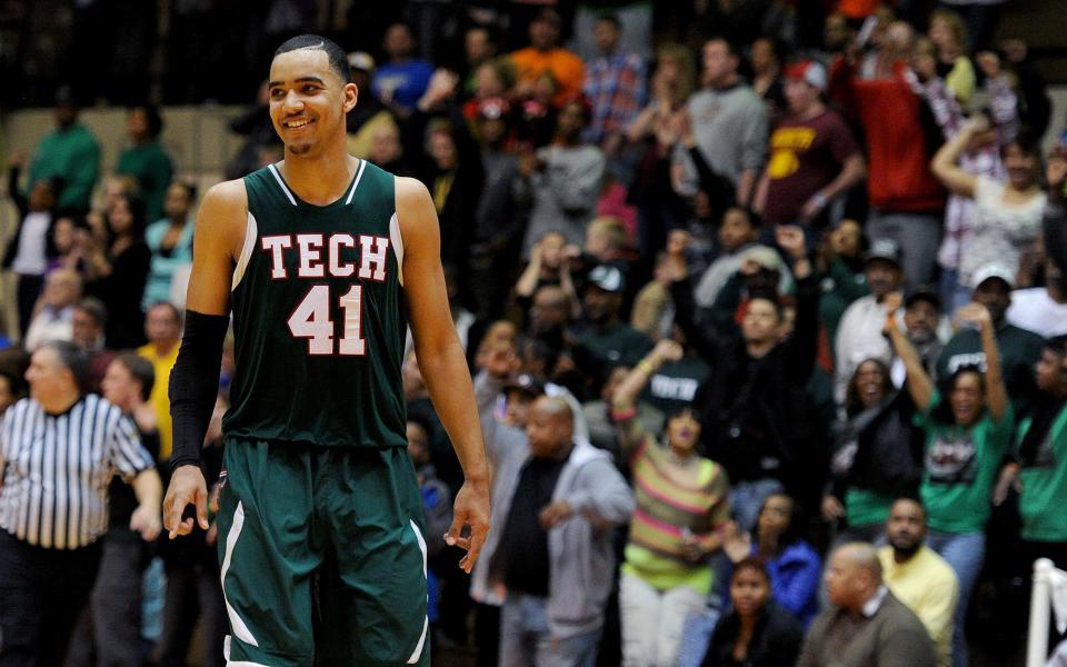 Arsenal Tech forward Trey Lyles was all smiles when the game ended against Bloomington North during the Class 4A Semistate game, Saturday, March 22, 2014, inside the Tiernan Center at Richmond High School. Tech won the game 75-71.