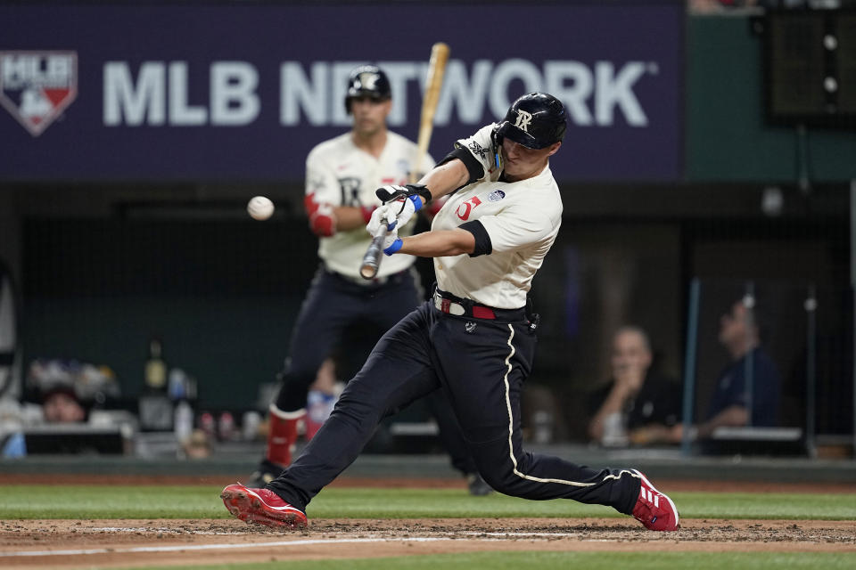 Texas Rangers' Corey Seager connects for a single off Seattle Mariners' Luis Castillo during the sixth inning of a baseball game Friday, June 2, 2023, in Arlington, Texas. (AP Photo/Tony Gutierrez)