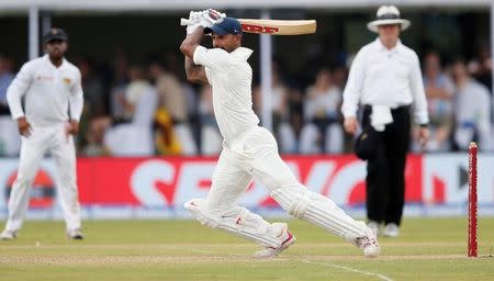 Cricket - Sri Lanka v India - First Test Match - Galle, Sri Lanka - July 26, 2017 - India's cricketer Shikhar Dhawan plays a shot. REUTERS/Dinuka Liyanawatte