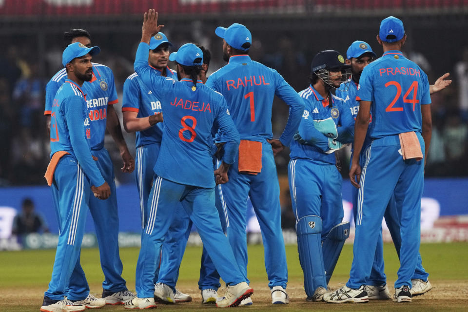 Indian team celebrates the wicket of Australia's David Warner during the second one day international cricket match between India and Australia in Indore, India, Sunday, Sept. 24, 2023. (AP Photo/Ajit Solanki)