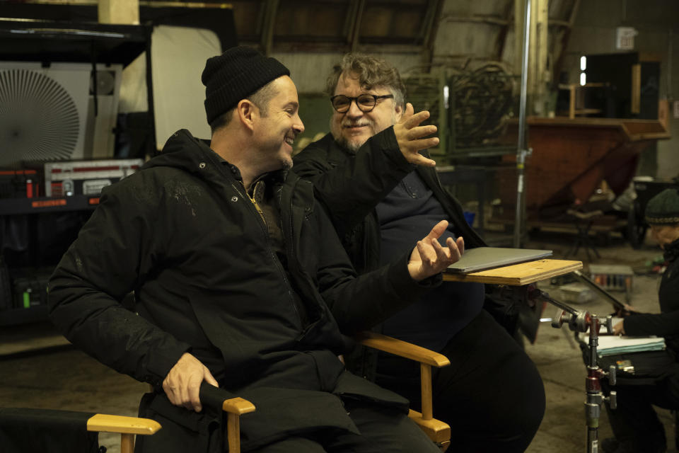 This image released by Searchlight Pictures shows director Scott Cooper, left, and Guillermo del Toro on the set of "Antlers." (Kimberly French/Searchlight Pictures via AP)