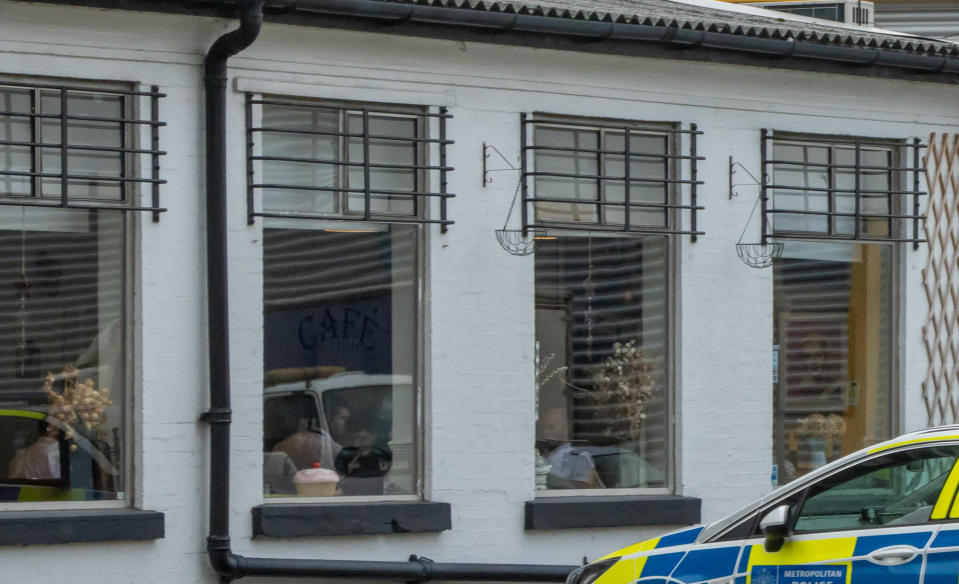 Photos taken by a passer-by show several police cars parked outside the eatery with a number of officers dining inside, despite restrictions banning gatherings and restaurants from operating table service. (SWNS)