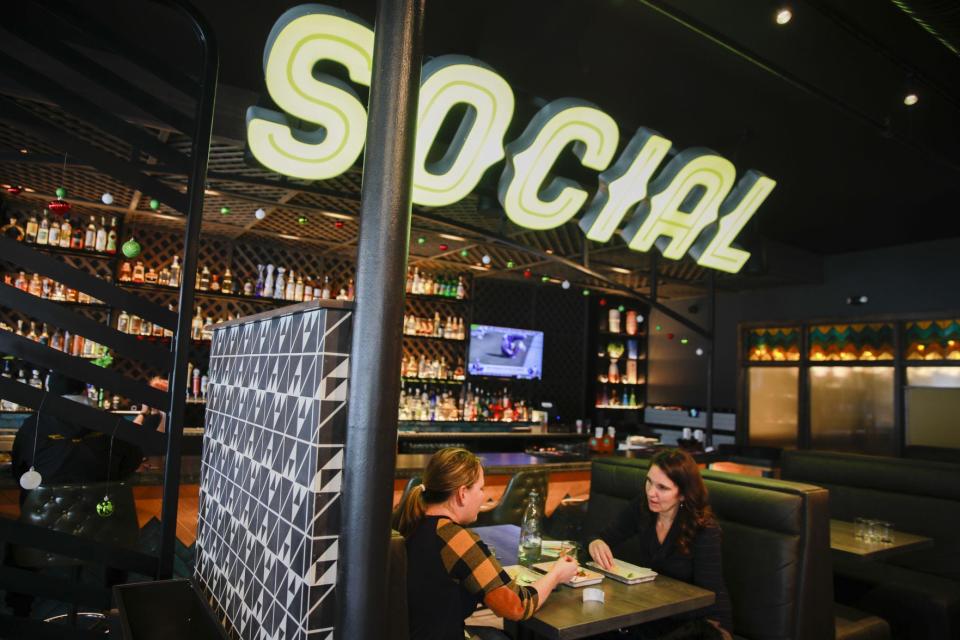 Mandy Baker, left, and Leslie Tait eat lunch at the Social Cantina in 2019.
