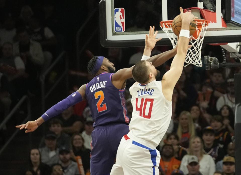 Phoenix Suns forward Josh Okogie (2) blocks a shot by LA Clippers center Ivica Zubac (40) during the fourth quarter at Footprint Center in Phoenix on Jan. 3, 2024.