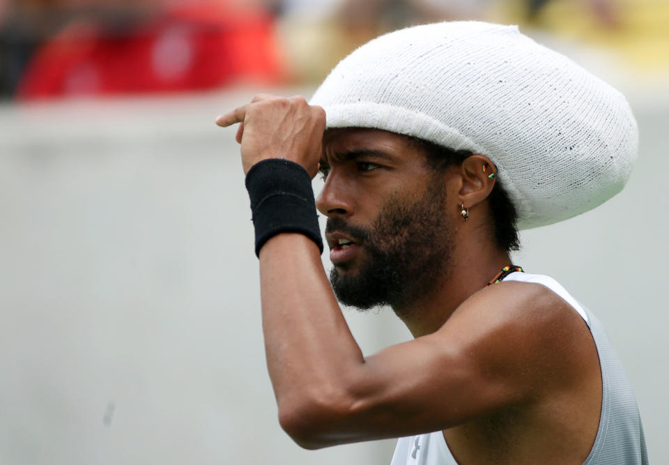 Dustin Brown (nickname: Dreddy) was Dreddless Sunday in his Olympic debut because of the haboob-like winds. (REUTERS/Kevin Lamarque)