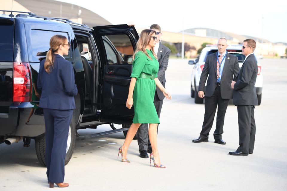 Melania Trump wore a kelly-green shirtdress in West Virginia. (Photo: Getty Images)