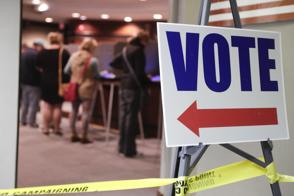 Voters cast their ballots early for the midterm elections at the Government & Judicial Center in Noblesville, Ind., Tuesday, Oct. 23, 2018. (AP Photo/Michael Conroy)