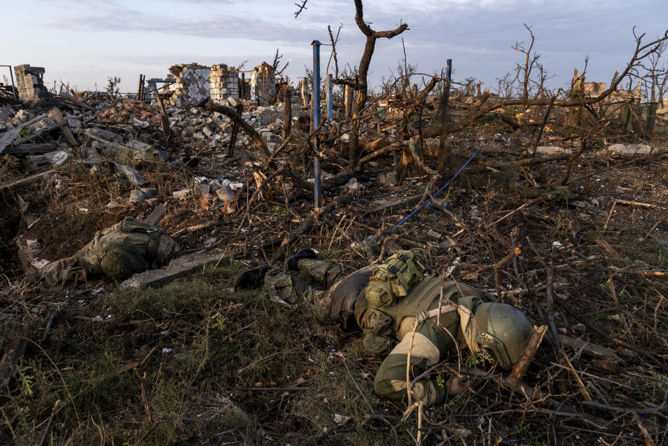 FILE - The bodies of Russian soldiers lie at the frontline in Andriivka, Donetsk region, Ukraine, Saturday, Sept. 16, 2023. (AP Photo/Mstyslav Chernov, File)