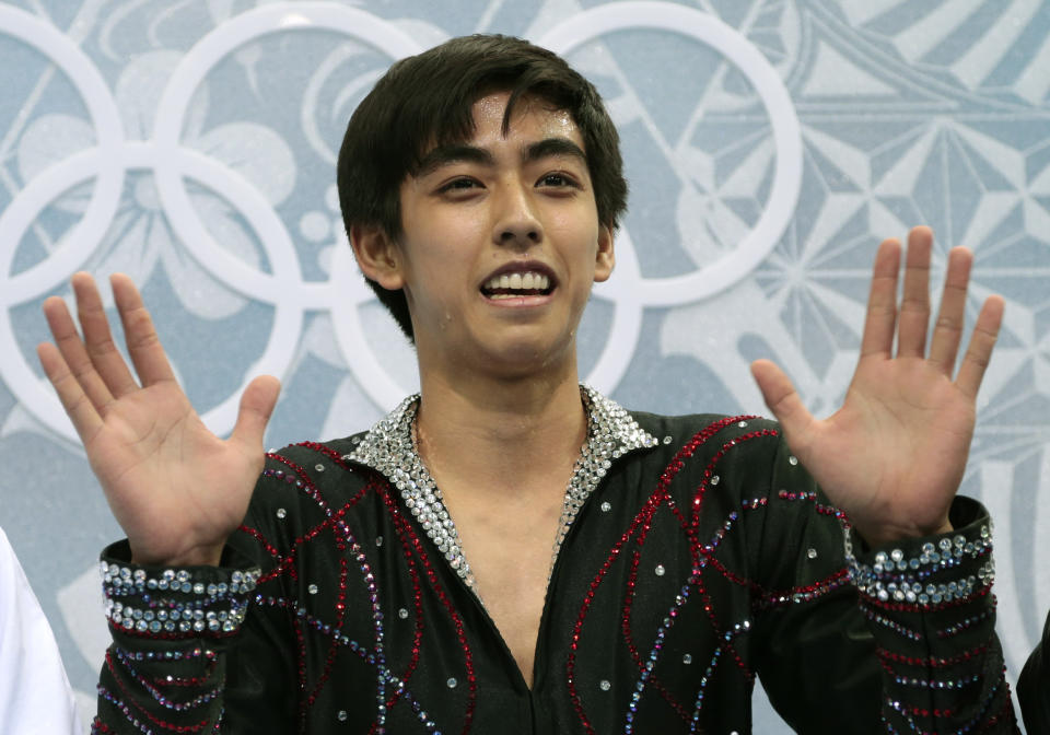 Michael Christian Martinez of the Philippines waves to spectators as he waits for his results after the men's free skate figure skating final at the Iceberg Skating Palace at the 2014 Winter Olympics, Friday, Feb. 14, 2014, in Sochi, Russia. (AP Photo/Ivan Sekretarev)