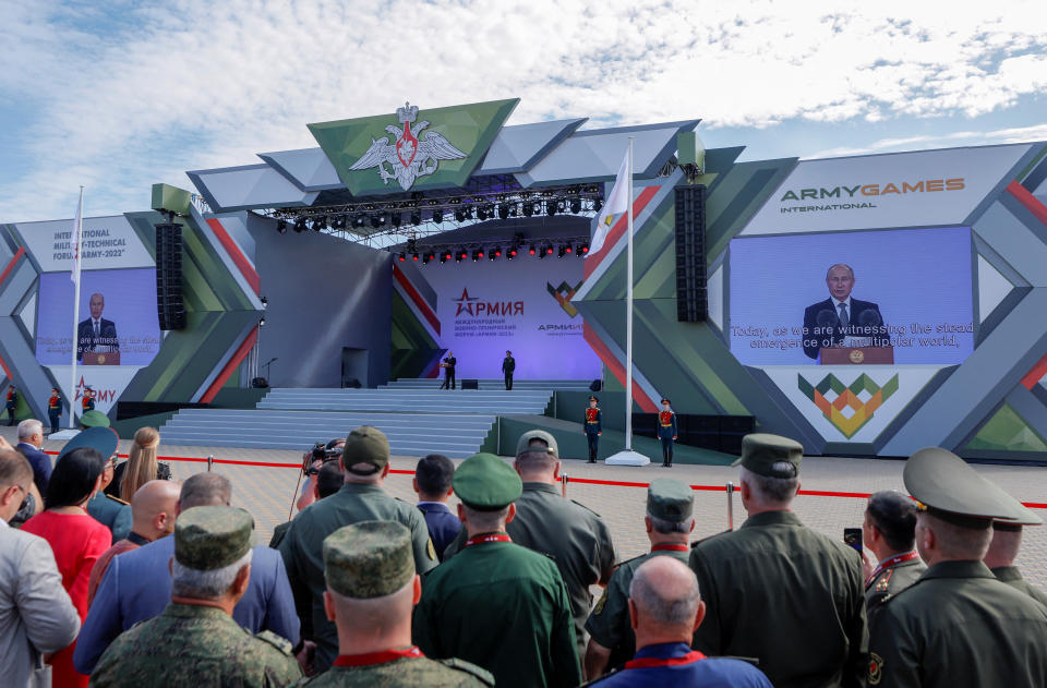 Participants listen to Russian President Vladimir Putin during a ceremony opening the international military-technical forum Army-2022 at Patriot Congress and Exhibition Centre in the Moscow region, Russia August 15, 2022. REUTERS/Maxim Shemetov