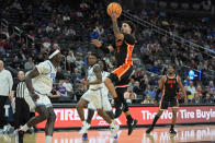 Oregon State guard Jordan Pope (0) shoots over UCLA during the second half of an NCAA college basketball game in the first round of the Pac-12 tournament Wednesday, March 13, 2024, in Las Vegas. (AP Photo/John Locher)