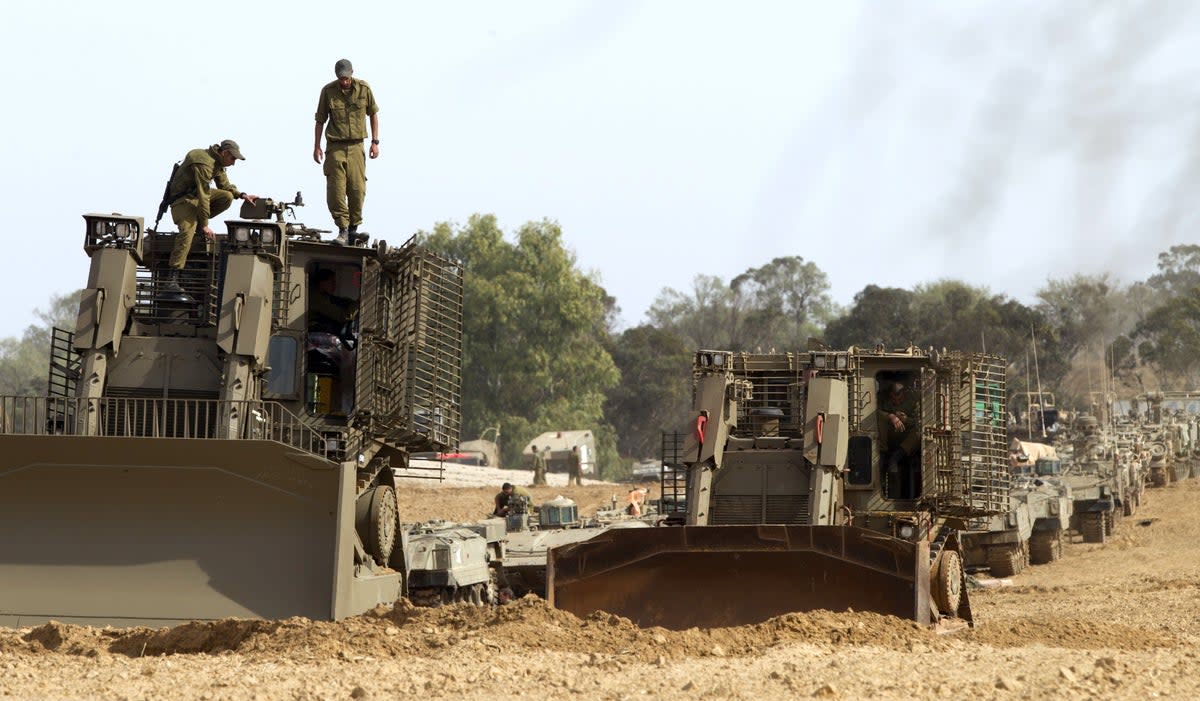 Israeli D9 bulldozers are stationed at the Israeli-Gaza Strip border (AFP via Getty Images)