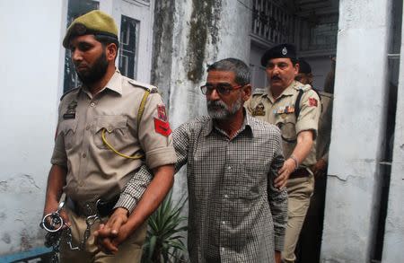 Sanji Ram arrives for a court appearance after he was arrested in connection with the rape and murder of an eight-year-old girl in Kathua, south of Jammu, April 16, 2018. REUTERS/Stringer