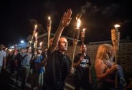 <p>Chanting “White lives matter! You will not replace us! and Jews will not replace us!,” several hundred white nationalists and white supremacists carrying torches marched in a parade through the University of Virginia campus in Charlottesville, Va., on Aug. 11, 2017. (Photo: Evelyn Hockstein/For The Washington Post via Getty Images) </p>