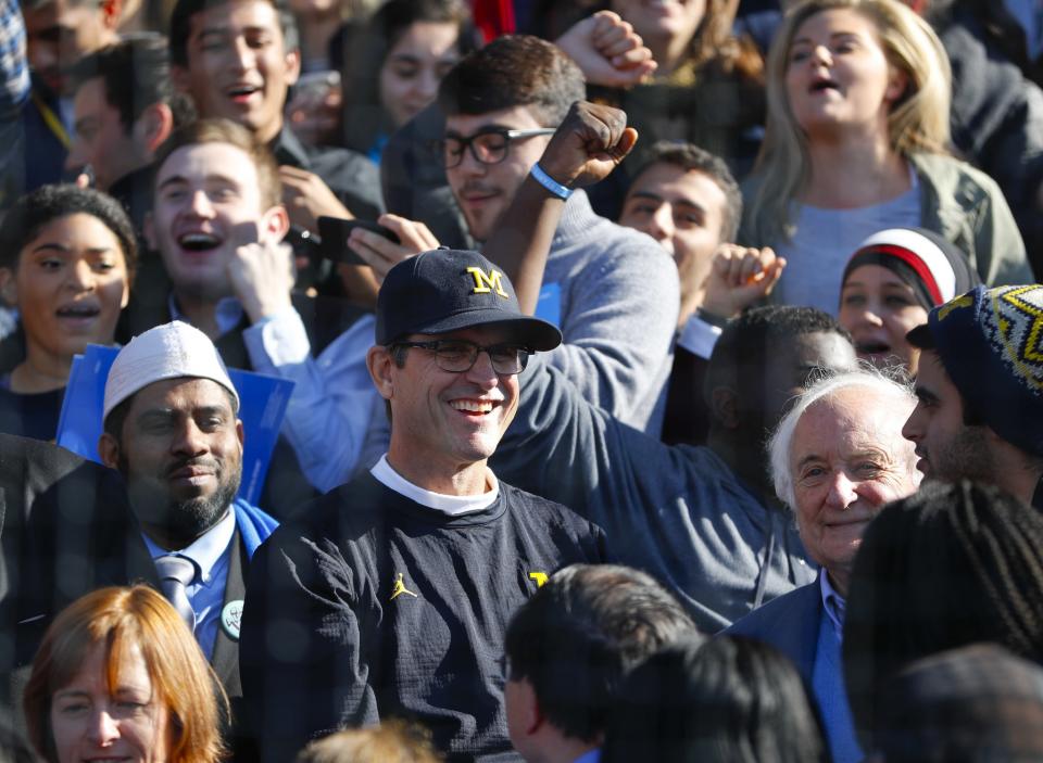 Michigan coach Jim Harbaugh attended a rally for Hillary Clinton at Michigan's baseball stadium. (AP)