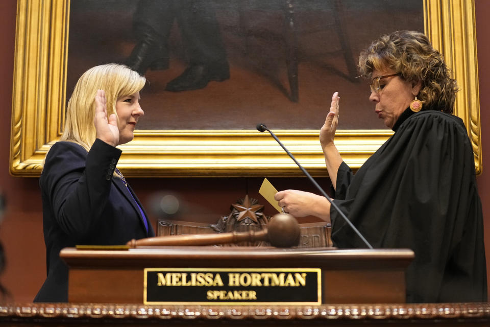 Speaker of the House Melissa Hortman, left, is sworn in by Justice Anne K. McKeig after being reelected for her third term during the first day of the 2023 legislative session, Tuesday, Jan. 3, 2023, in St. Paul, Minn. (AP Photo/Abbie Parr)